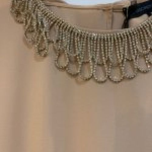 BLUSA DE GASA CORTA CON LAZADA EN LA ESPALDA