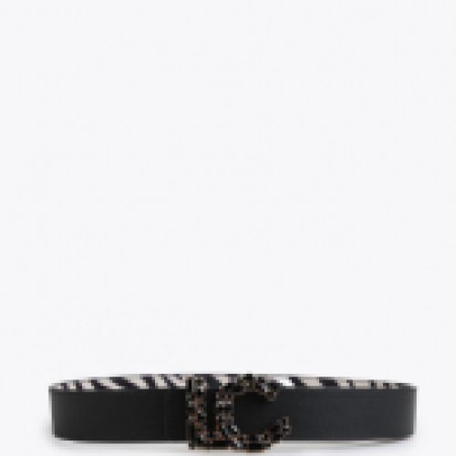 Cinturón reversible con estampado animal print byn, reverso en negro, hebilla LC con cristales en negro, de Lola Casademunt