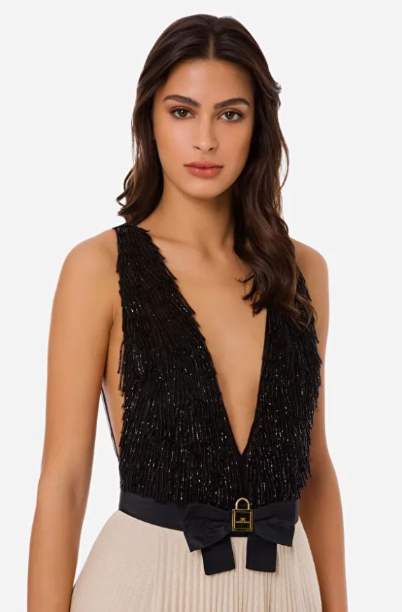 Vestido largo con falda de punto lúrex dorado con cuerpo de tul negro bordado en paillettes de Elisabetta Franchi